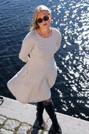 Denise's beige dress